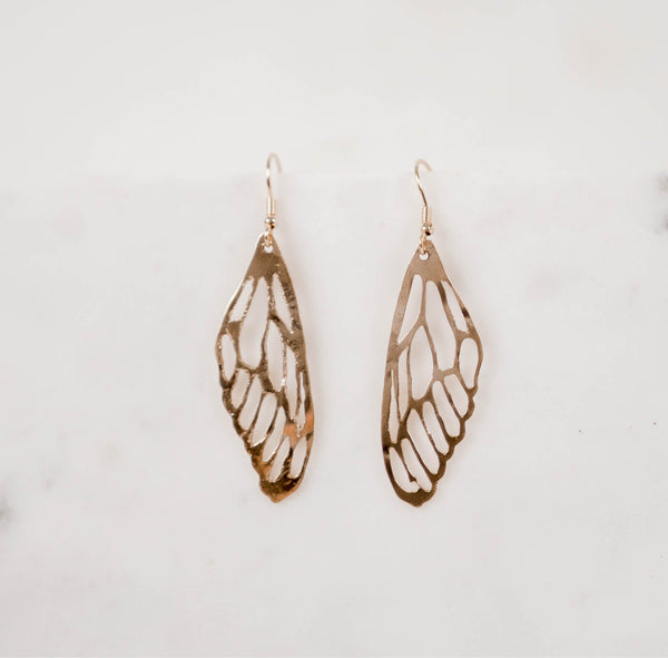 Hand crafted hammered dragonfly wing earrings on a white background by Krista Knickerbocker Designs.