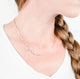 Image is zoomed into woman's neck wearing Krista Knickerbocker Designs' 14k gold filled everyday chain.  Chain length is about 18 inches and sits above the collar.  Handmade sterling silver hook clasp is featured in this image.