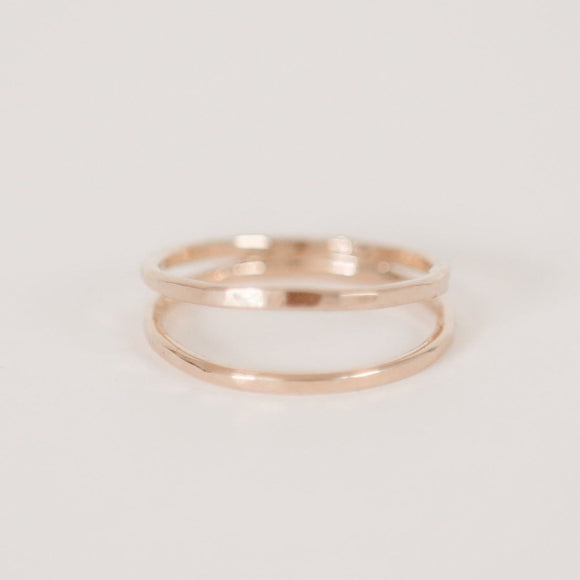 Double band handcrafted gold vermeil ring by Krista Knickerbocker Designs on a white background.  Ring has one smooth and one hammered shiny gold band connected at the back.