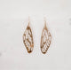 Hand crafted hammered dragonfly wing earrings on a white background by Krista Knickerbocker Designs. 